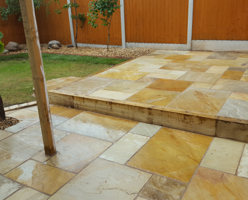 Twin level patio created in Fossil Mint Indian sandstone